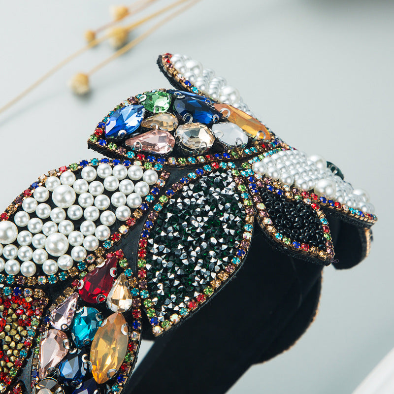 Haarreifen mit Strass- und Perlenverzierung
